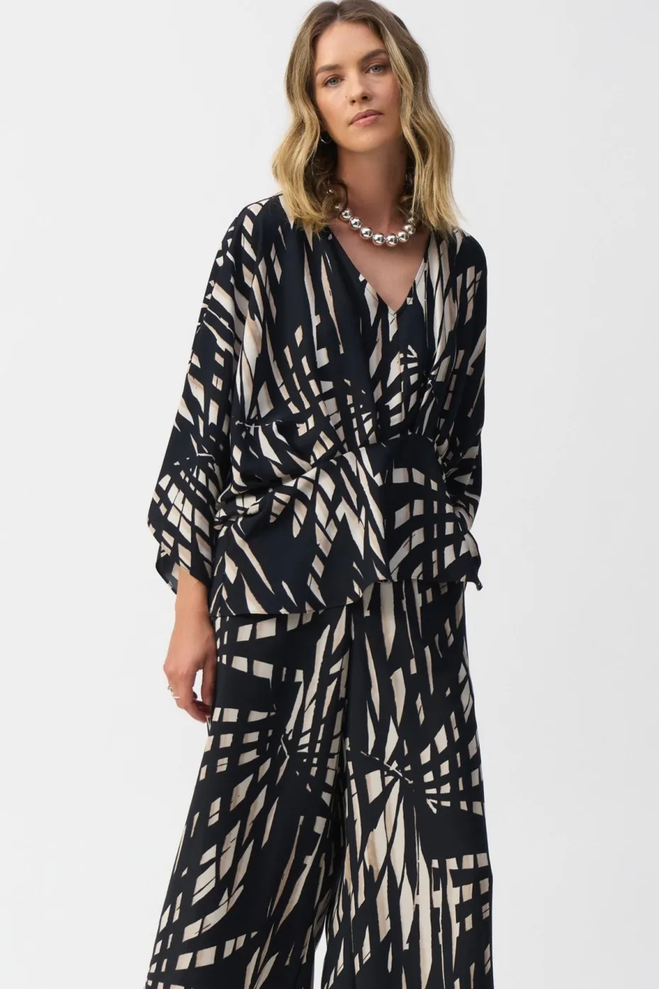 Joseph Ribkoff Peplum Top in Black Vanilla Tropical 251047